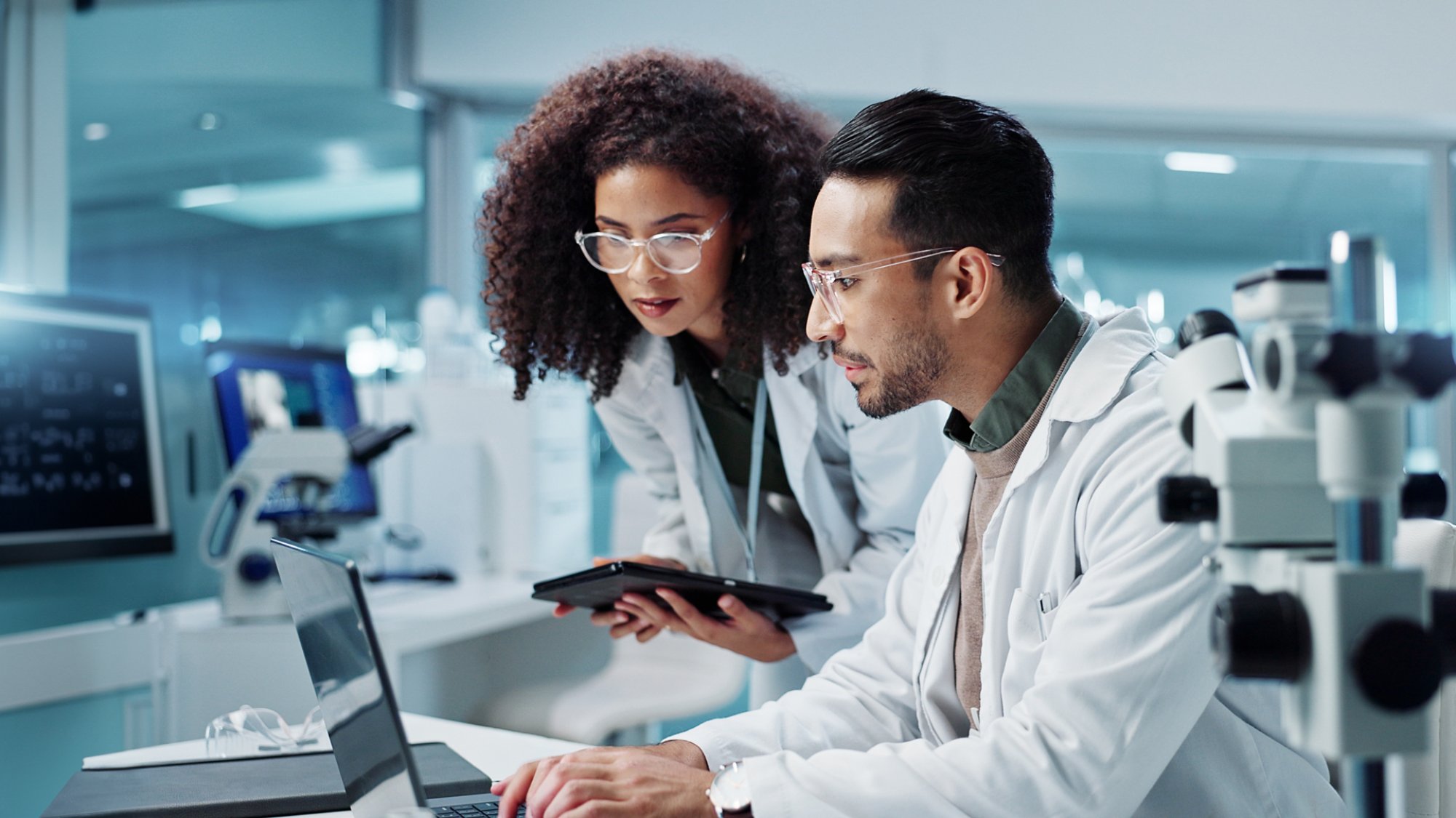 Science, teamwork and scientist with tablet in laboratory for communication, pharmaceutical review or planning. Employees, collaboration and technology for research, discussion and digital analysis.