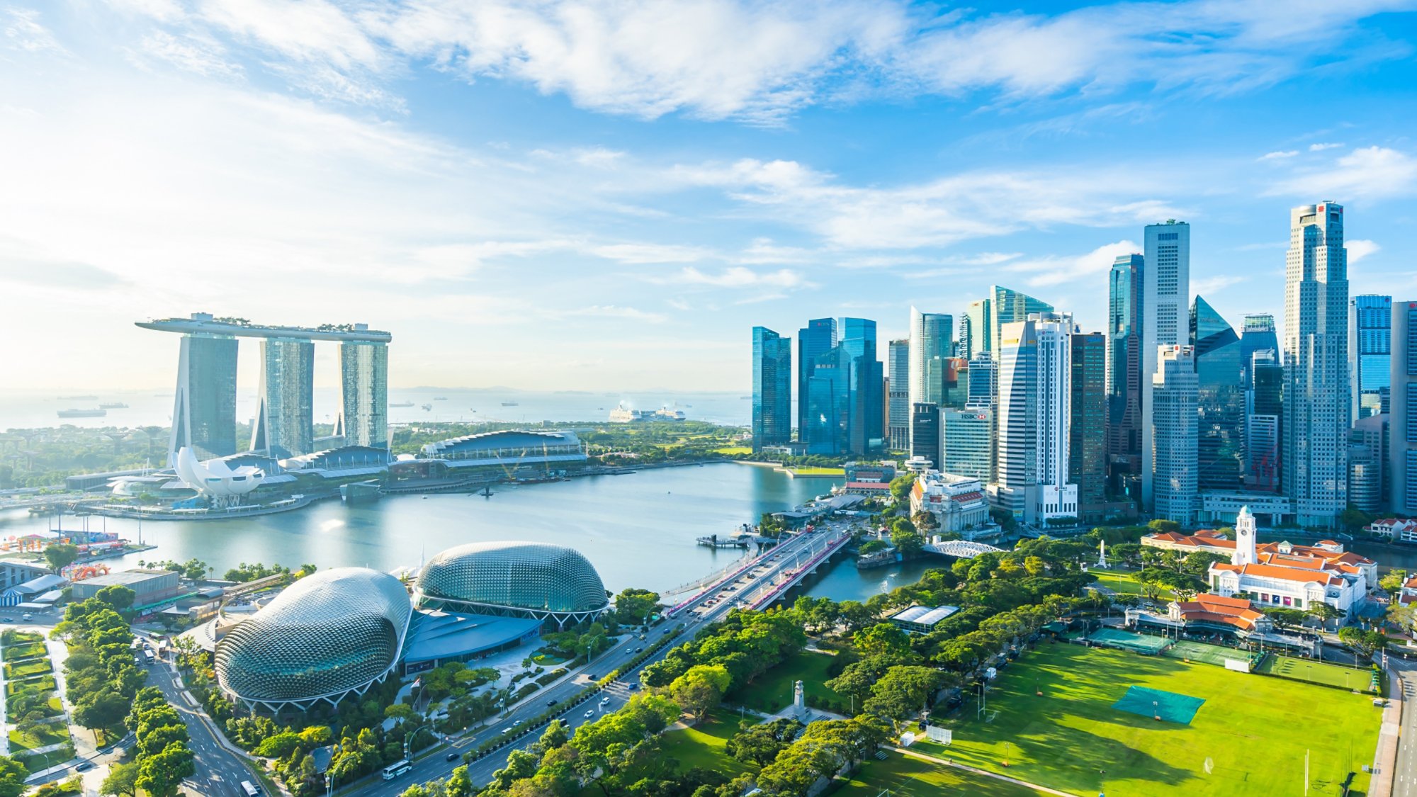 Beautiful architecture building exterior cityscape in Singapore city skyline with white cloud on blue sky