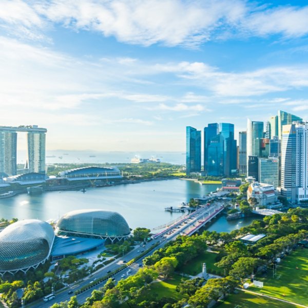 Beautiful architecture building exterior cityscape in Singapore city skyline with white cloud on blue sky