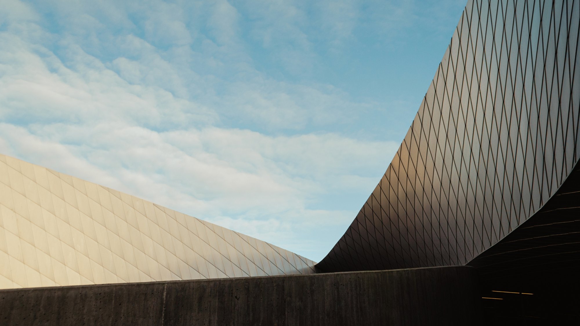 sloped architecture facade with blue sky