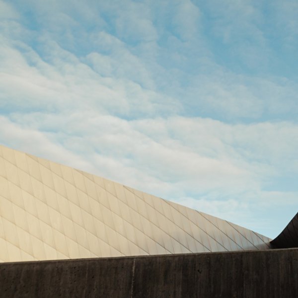 sloped architecture facade with blue sky