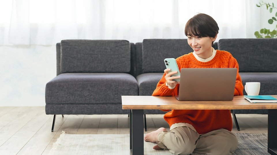 asian-woman-using-laptop-cellphone