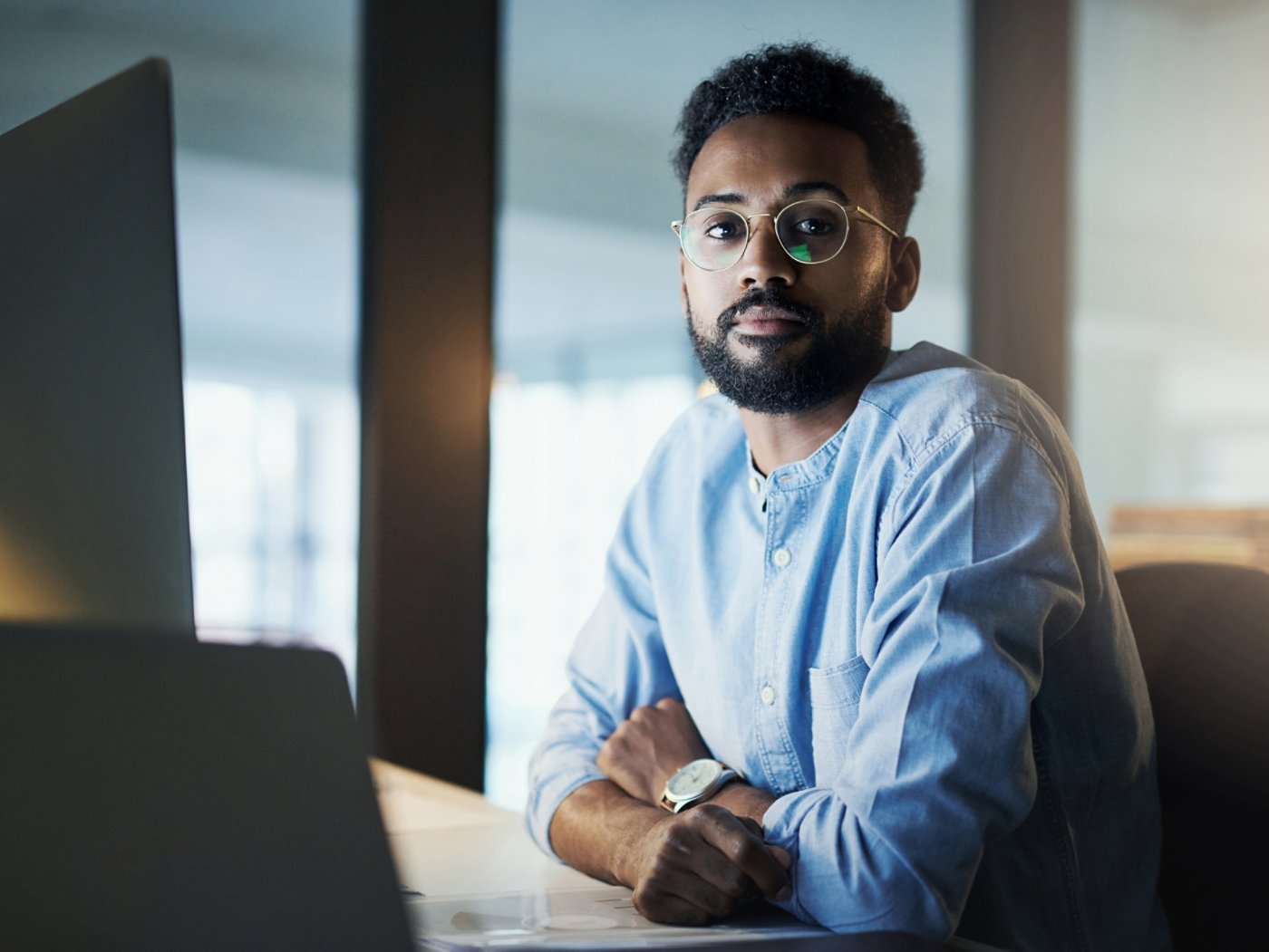 Portrait of a young businessman working in an office at night