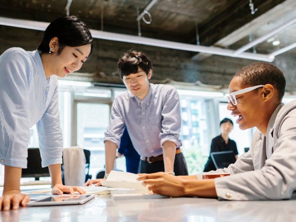 Three people in a meeting