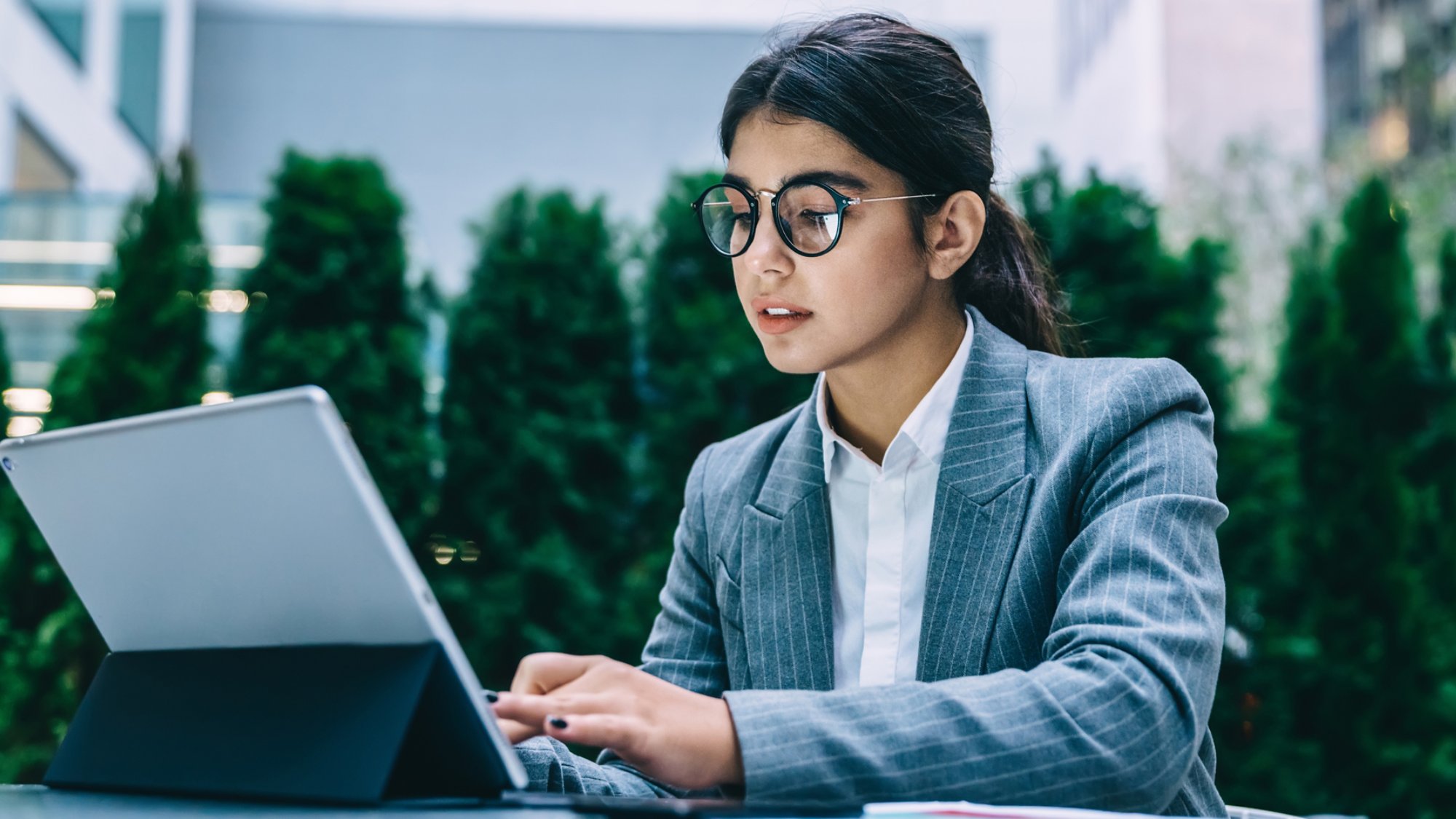 Female IT professional working on laptop