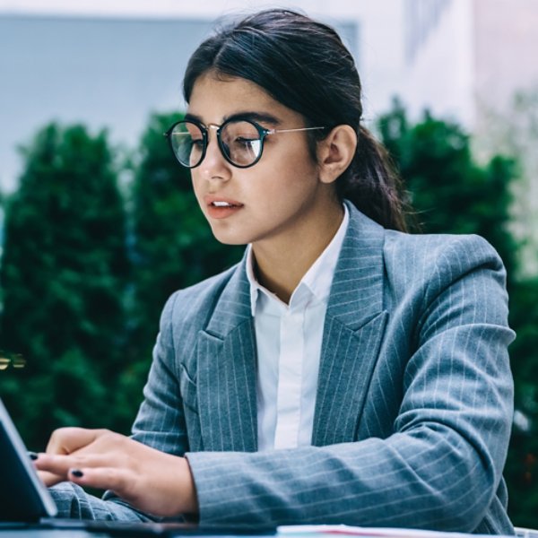 Female IT professional working on laptop