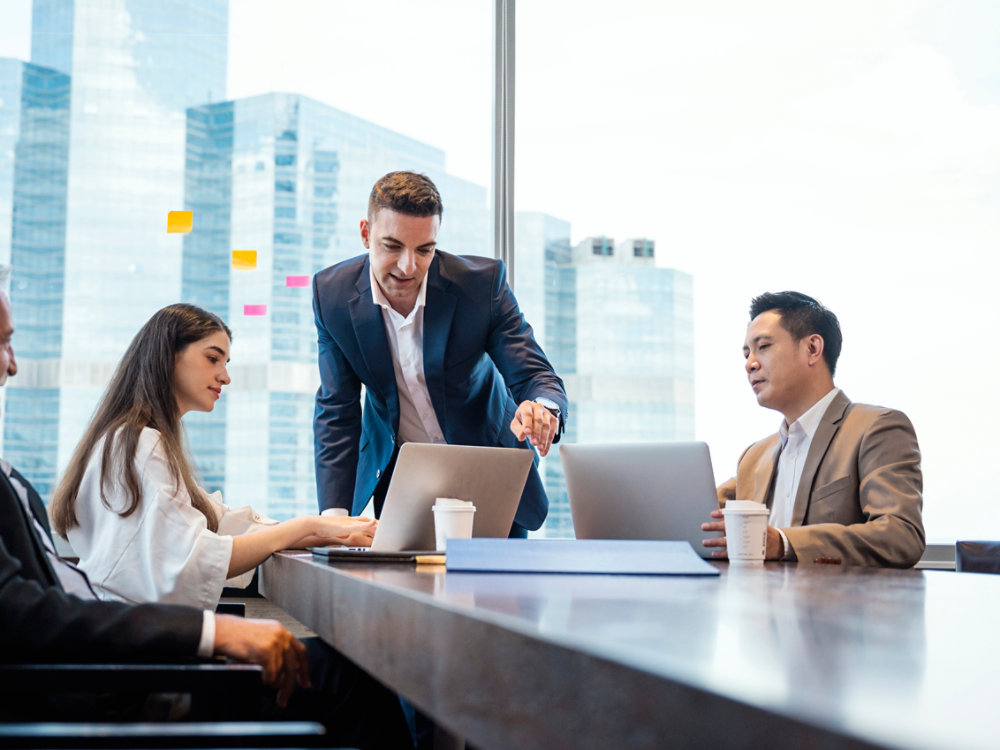 Business Brainstorming. Business development manager giving ideas to business people at meeting in big conference room. Global business, Multi-ethnic Professional teamwork.