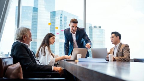 Business Brainstorming. Business development manager giving ideas to business people at meeting in big conference room. Global business, Multi-ethnic Professional teamwork.