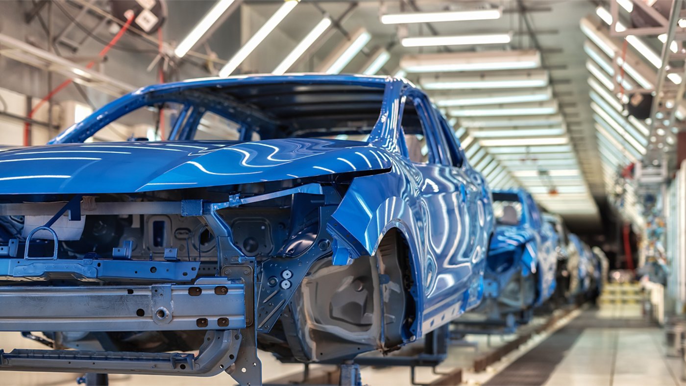 auto chassis assembly line painted blue