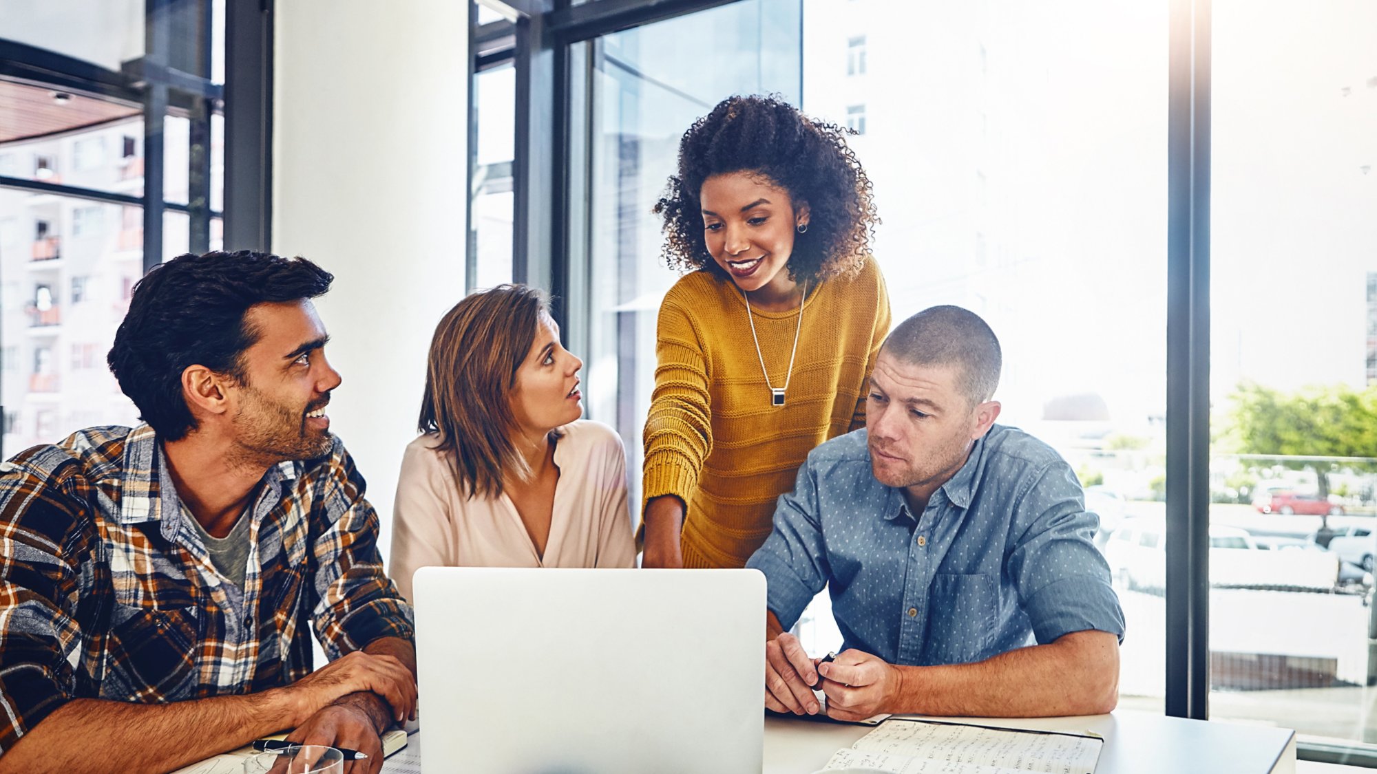 Web designer, planning and team in office with laptop, market research or problem solving in development of project. Website, design and people with technology for online marketing, SEO or strategy.