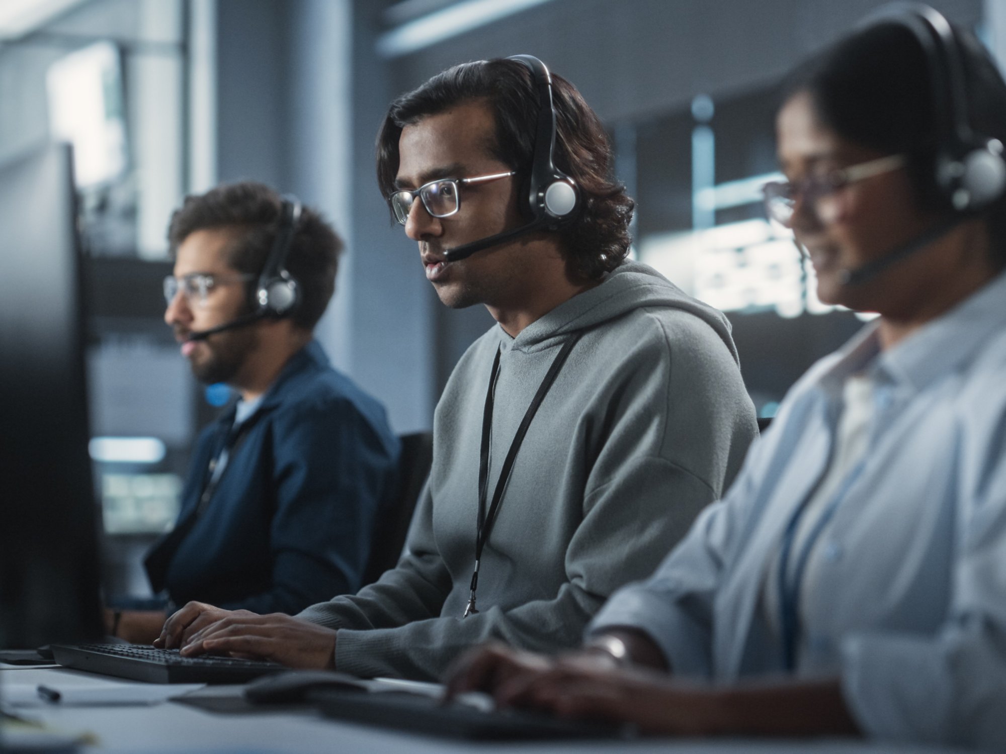 Indian Customer Support Team Using Computers and Talking with Clients Onlinel. Help Desk Employees Responds to Queries, Resolve Problems and Troubleshoot Issues, Implementing Solutions