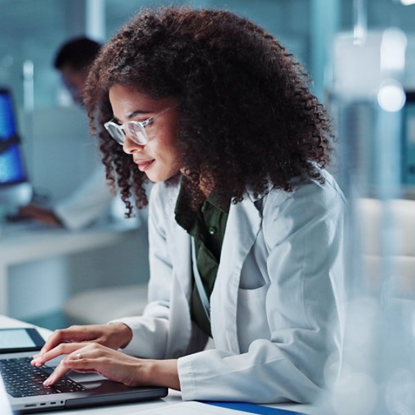 Woman. laptop and lab for research science or online internet for futuristic discovery, microscope or medicine. Female person, brainstorming and biotechnology for investigation, cure or development.