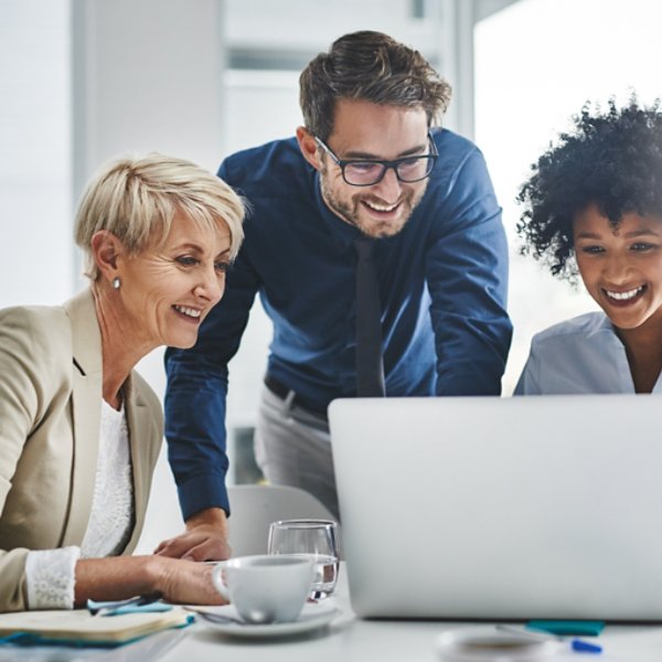 Shot of a group of businesspeople working together on a laptop