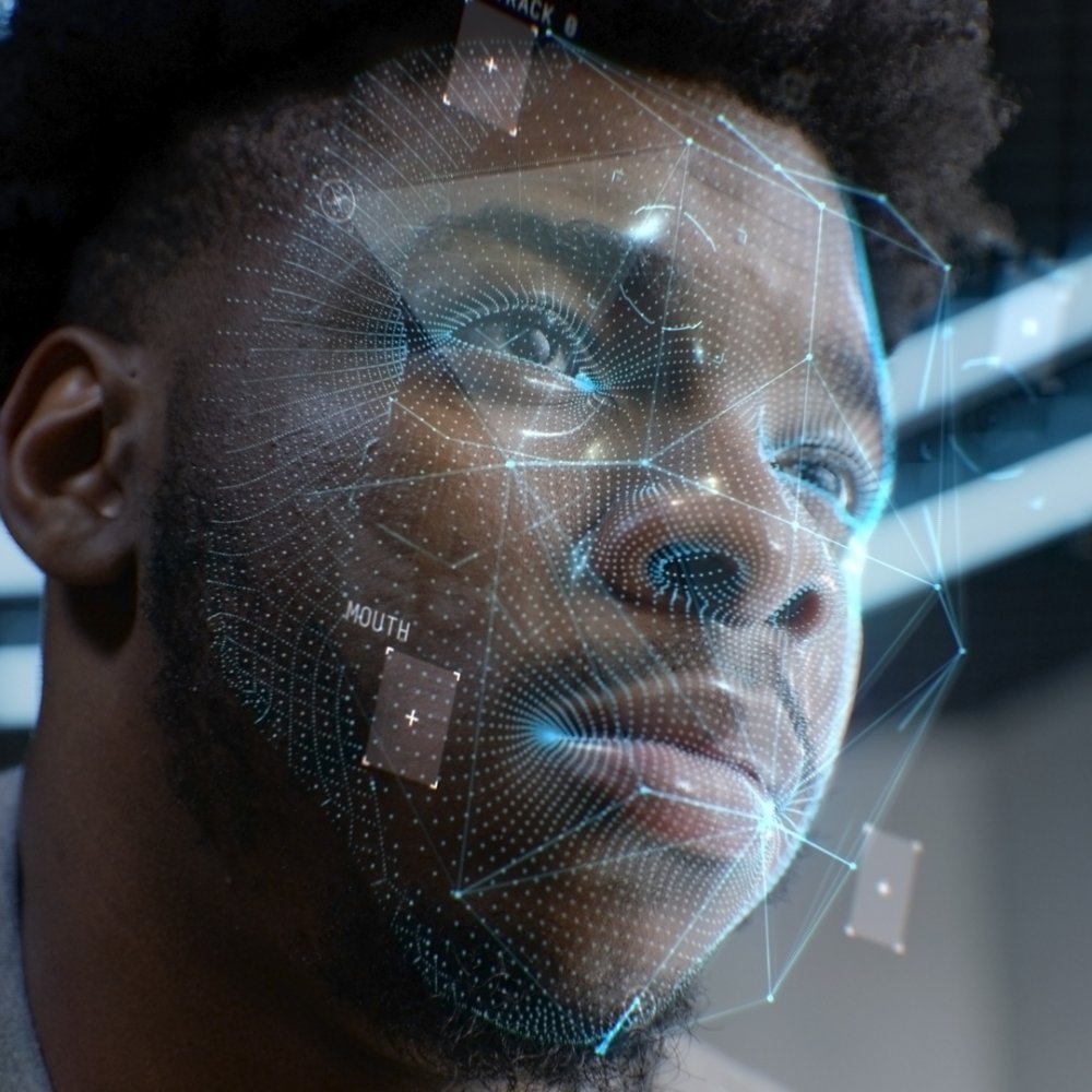 Face portrait of young African American man with focused look. 3D animation of human futuristic AI biometric face recognition system. Identification for access. Privacy and modern scanning technology.