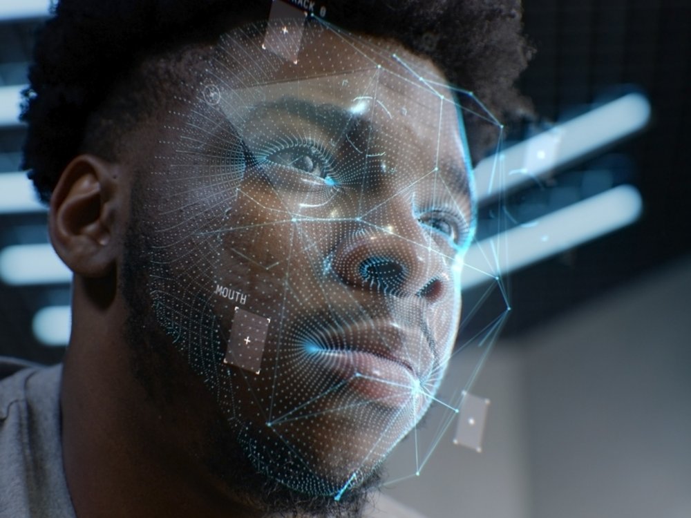 Face portrait of young African American man with focused look. 3D animation of human futuristic AI biometric face recognition system. Identification for access. Privacy and modern scanning technology.