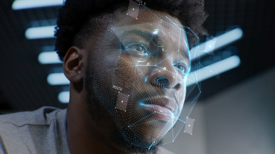 Face portrait of young African American man with focused look. 3D animation of human futuristic AI biometric face recognition system. Identification for access. Privacy and modern scanning technology.