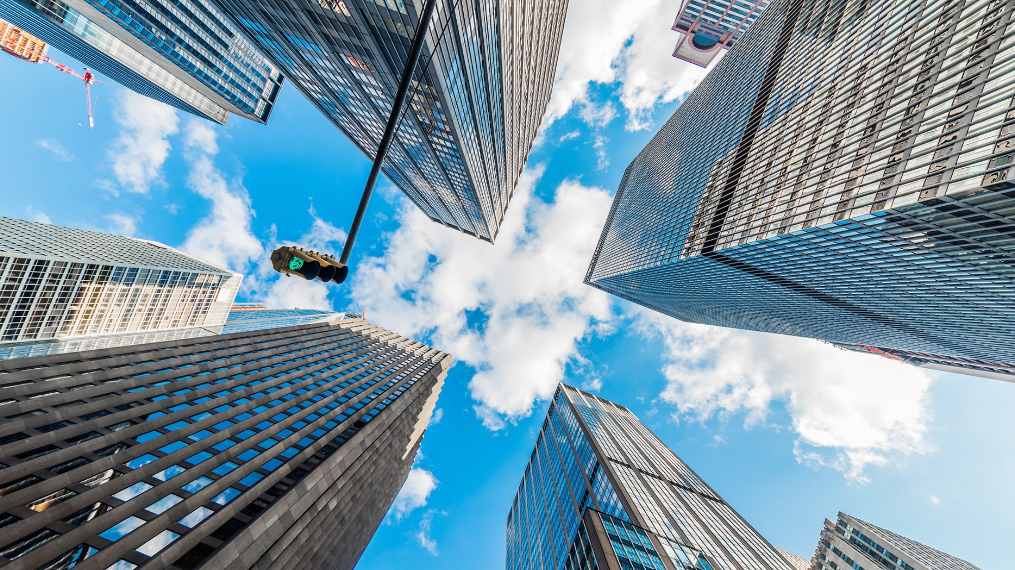 Skyscrapers in a finance district at Manhattan. New York, USA. Perspective view of modern skyscrapers glass wall. 
