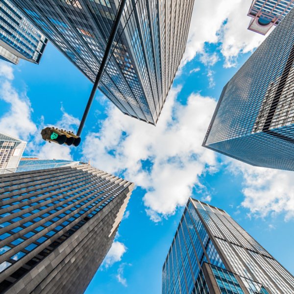 Skyscrapers in a finance district at Manhattan. New York, USA. Perspective view of modern skyscrapers glass wall. 
