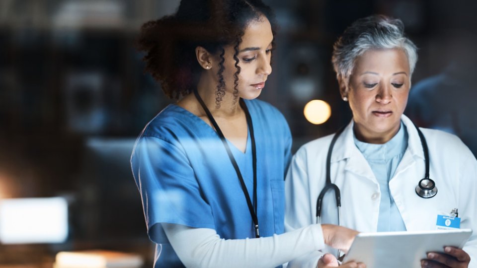 Women, doctors and tablet for night medical research, surgery planning and teamwork in hospital. Nurse, healthcare and worker collaboration on technology in late shift for wellness thinking and ideas.