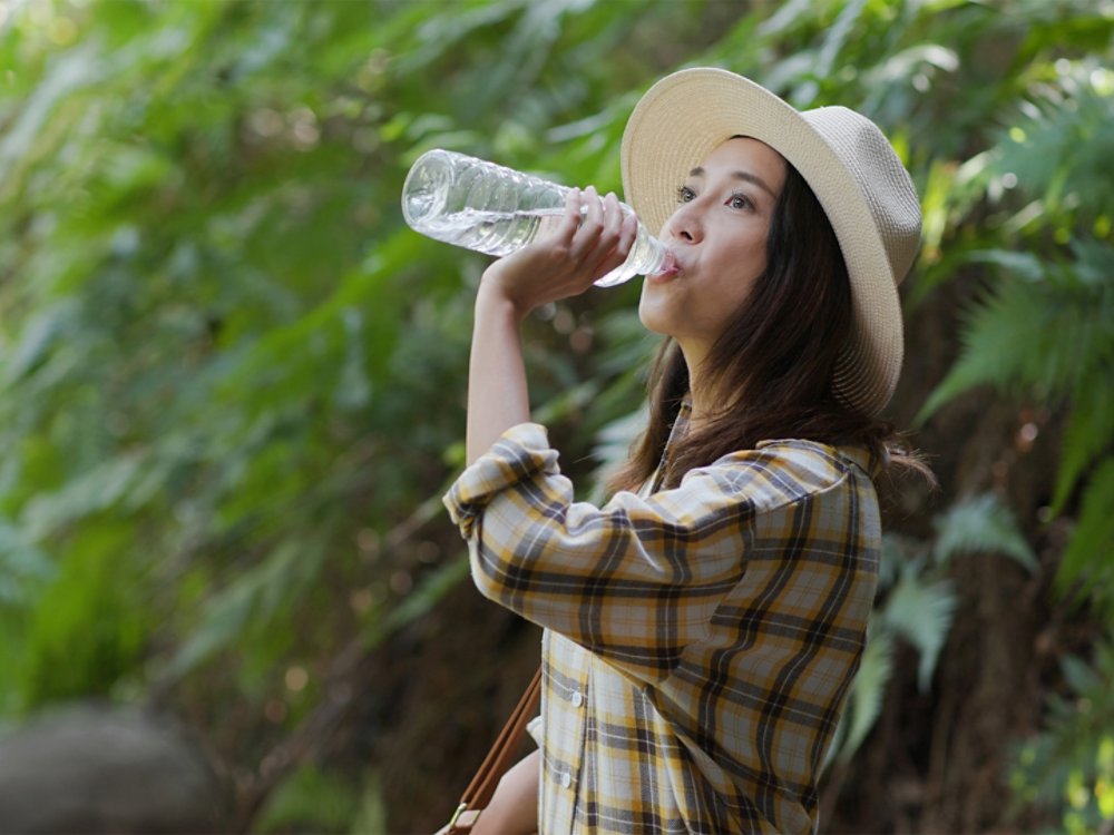 Woman drink of water when hiking