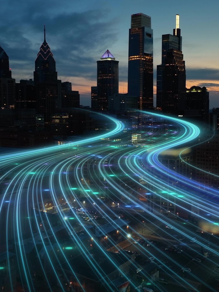 Smart city digital transformation development concept. Band lights over modern urban cityscape at night. New fast internet communication 5G technology. Fiber Optics