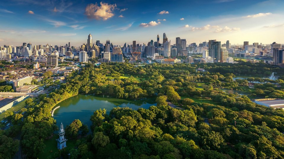 Lumpini park and Bangkok city building view from roof top bar on hotel, Bangkok, Thailand