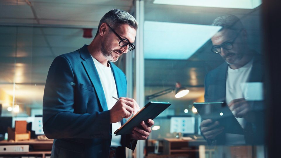 Mature programmer, tablet and stylus with report, overtime work or project email review. Web design, night or update thinking for man, cloud computing and agency research or online communication.