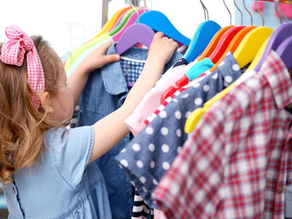 Cute baby girl in baby shop store