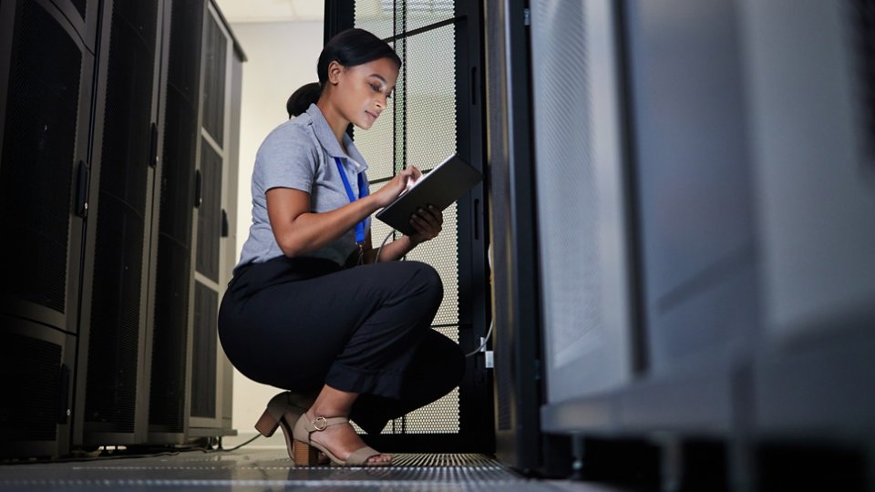 Engineer, server room and woman with tablet for database connection cable, maintenance or software update at night. Cybersecurity, it and female coder with technology for networking in data center