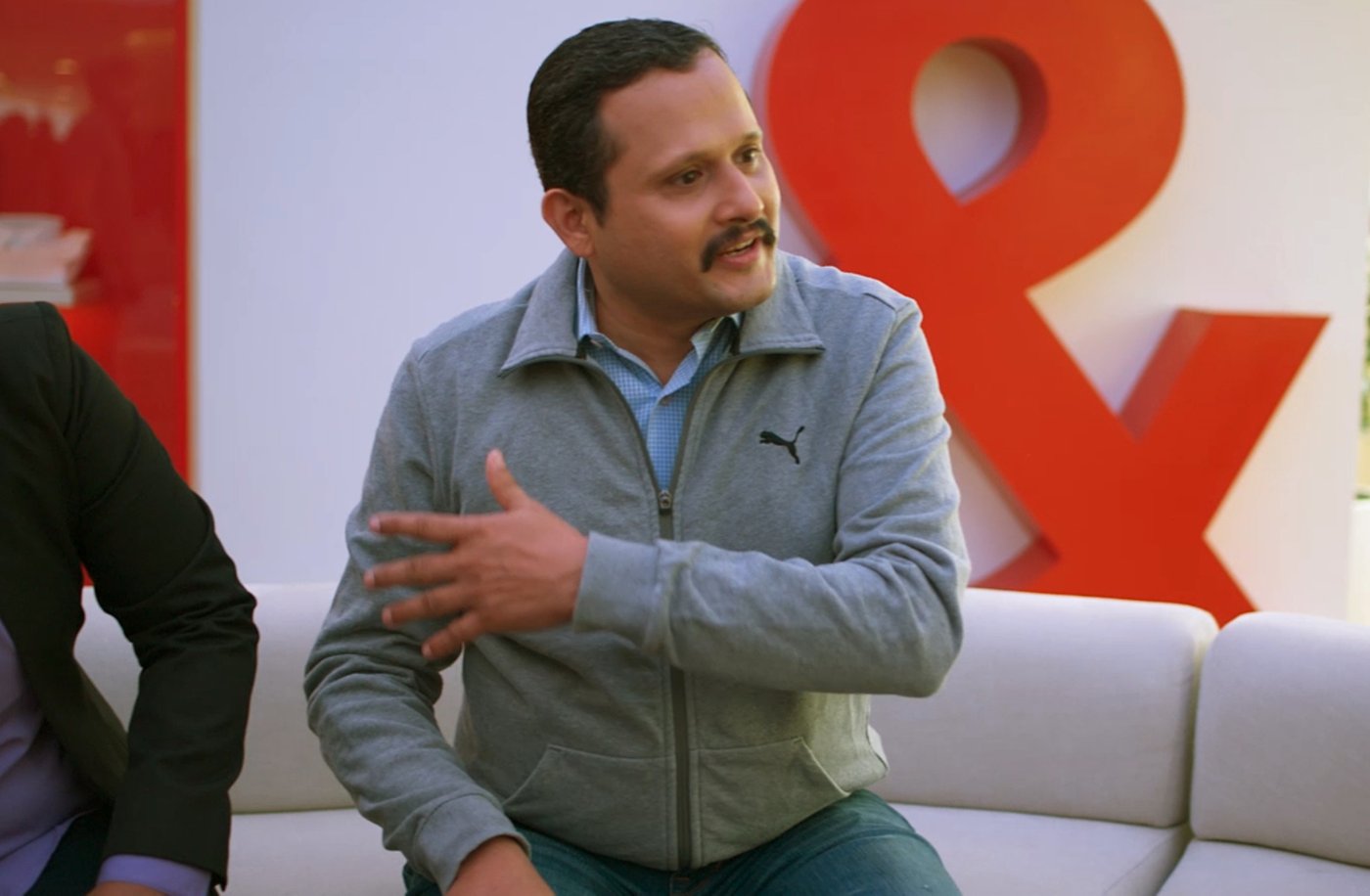 male Kyndryl employee explaining a project solution