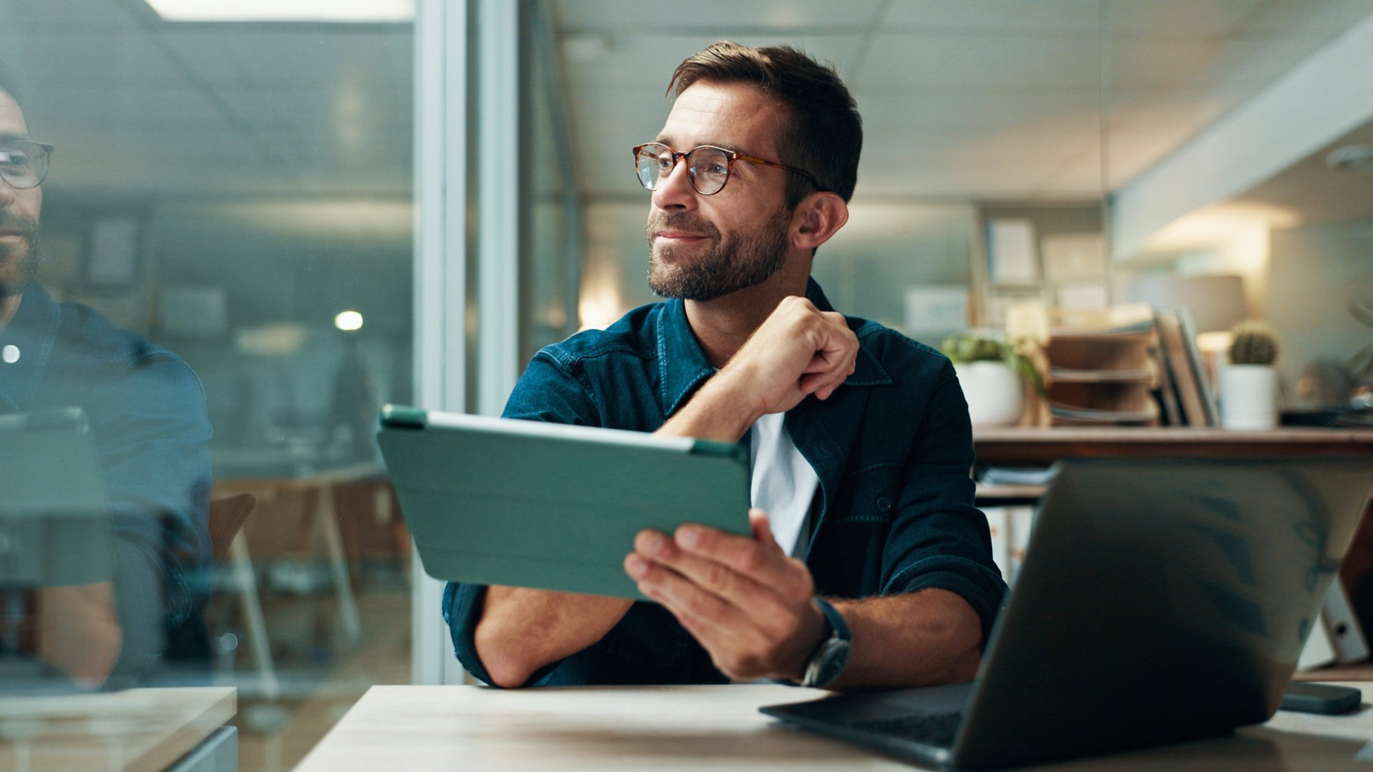 Tablet, thinking and smile with business man in office for planning, ui designer and app review. Developer solutions, reflection and research with person in agency for project idea and startup.