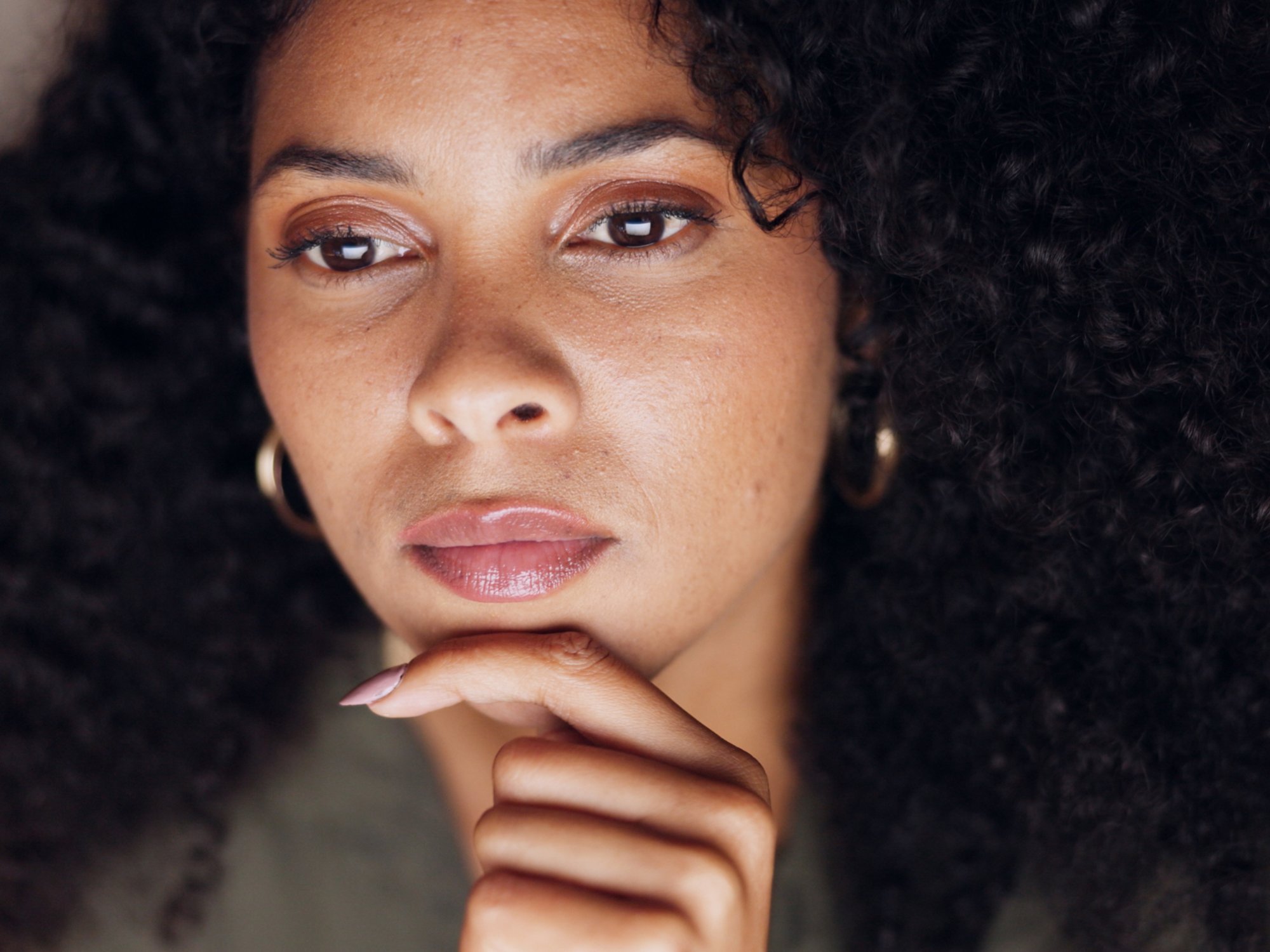 Work, overtime and thinking, business woman with idea working late on corporate startup company project or report. Night at office, deadline and black woman with serious commitment to evening trade