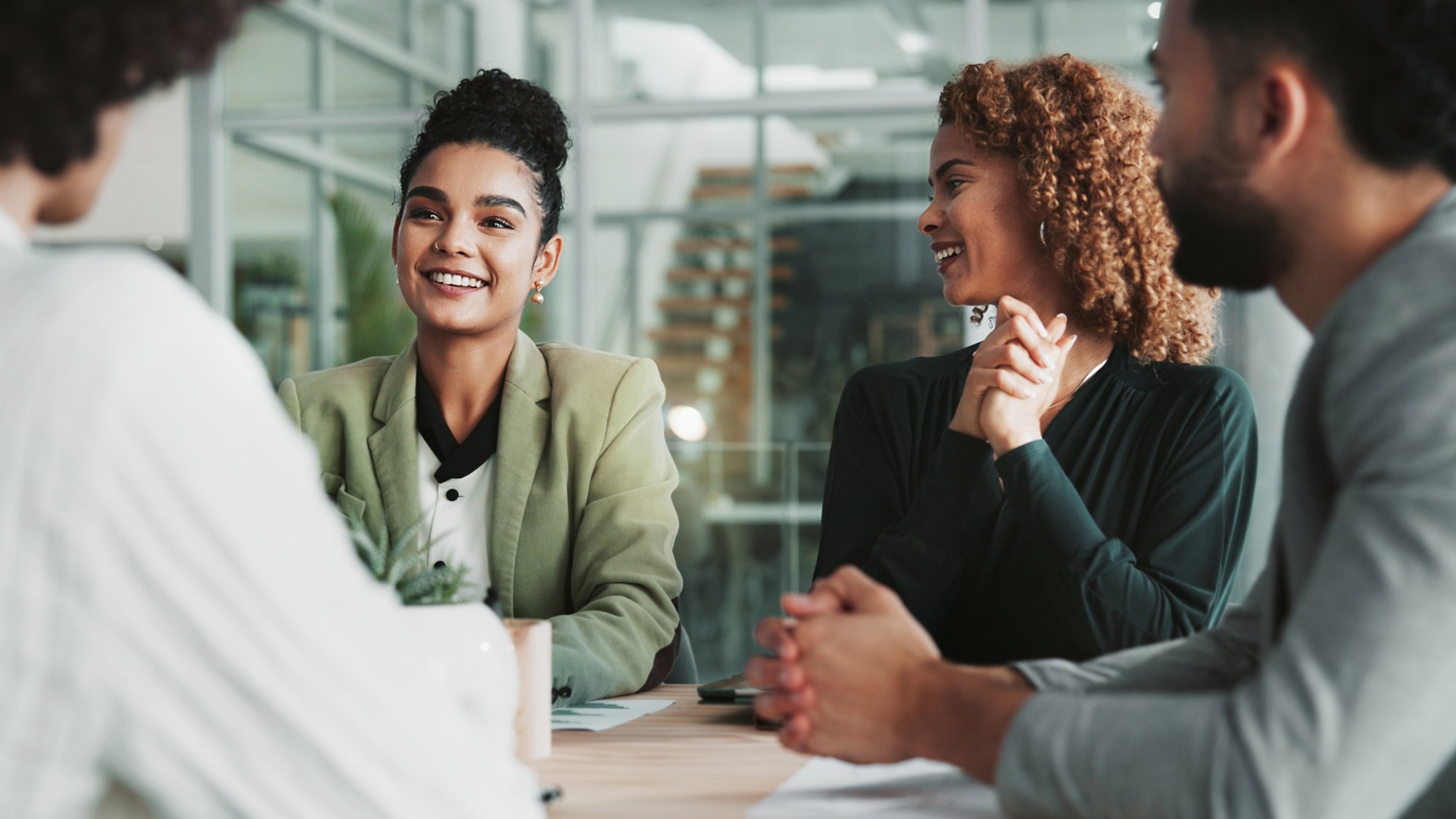 Meeting, planning and review with business people in boardroom of office together for collaboration. Feedback, project management and smile with employee team in workplace for development or strategy.