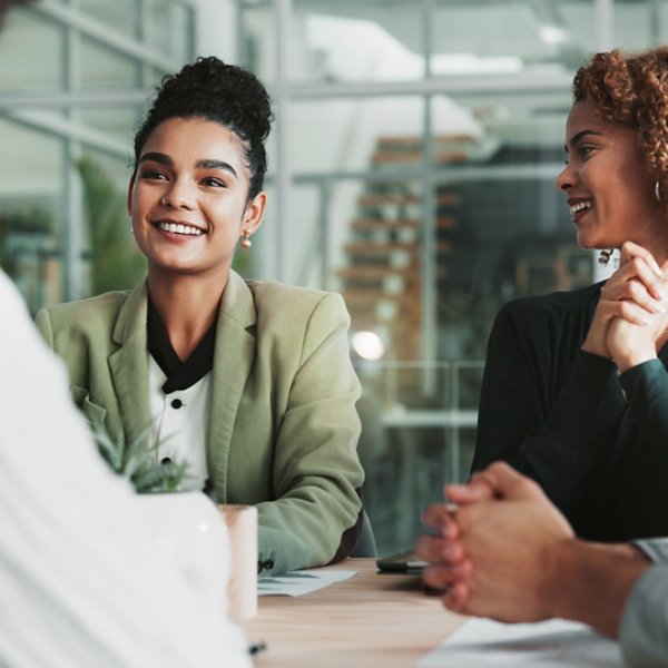 Meeting, planning and review with business people in boardroom of office together for collaboration. Feedback, project management and smile with employee team in workplace for development or strategy.