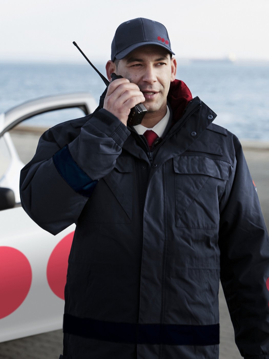 Security guard in harbor on phone