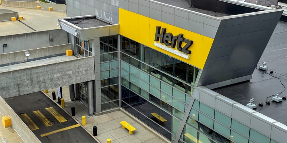 New York, 4-16-2021: The front of the Hertz car rental location at the JFK airport.