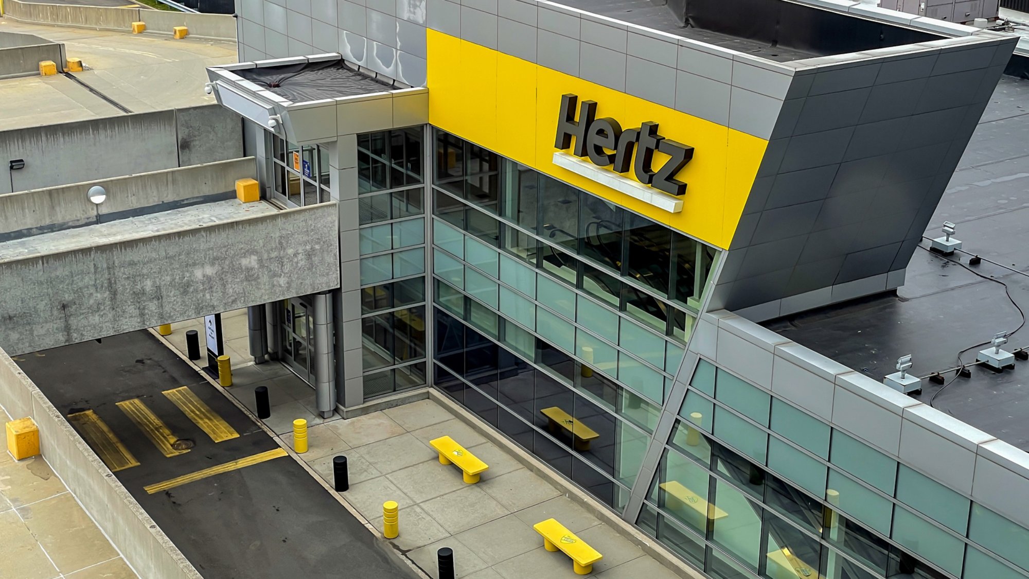 New York, 4-16-2021: The front of the Hertz car rental location at the JFK airport.
