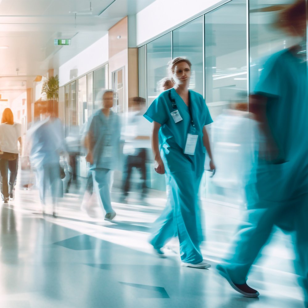 Hospital workers walking down hallway