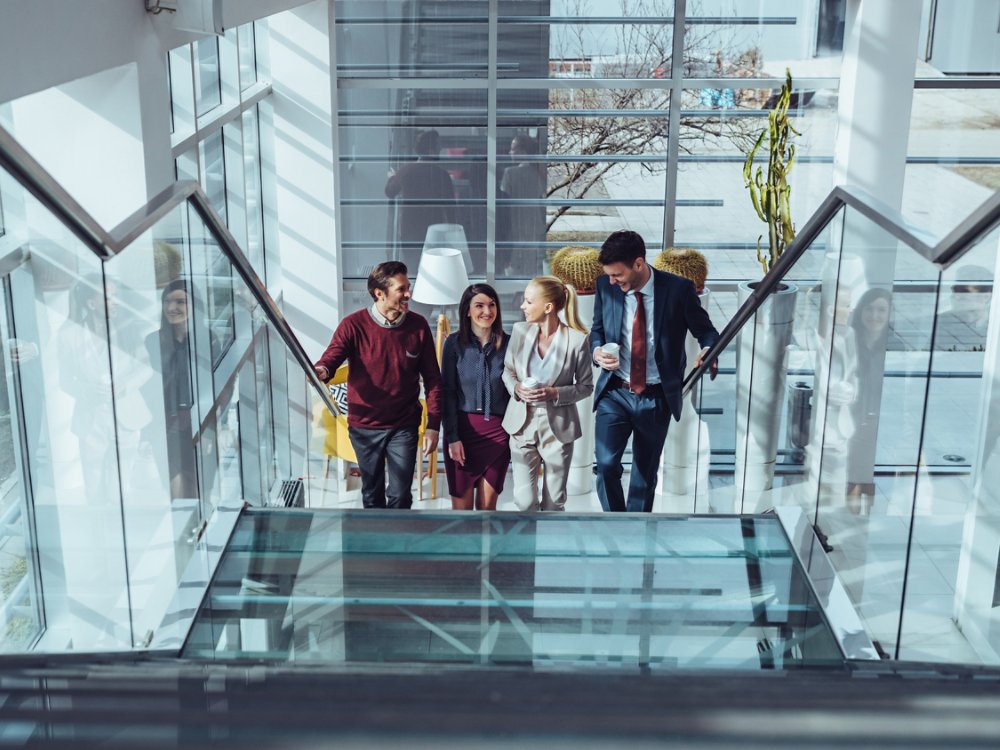 Business colleagues drinking coffee during office break