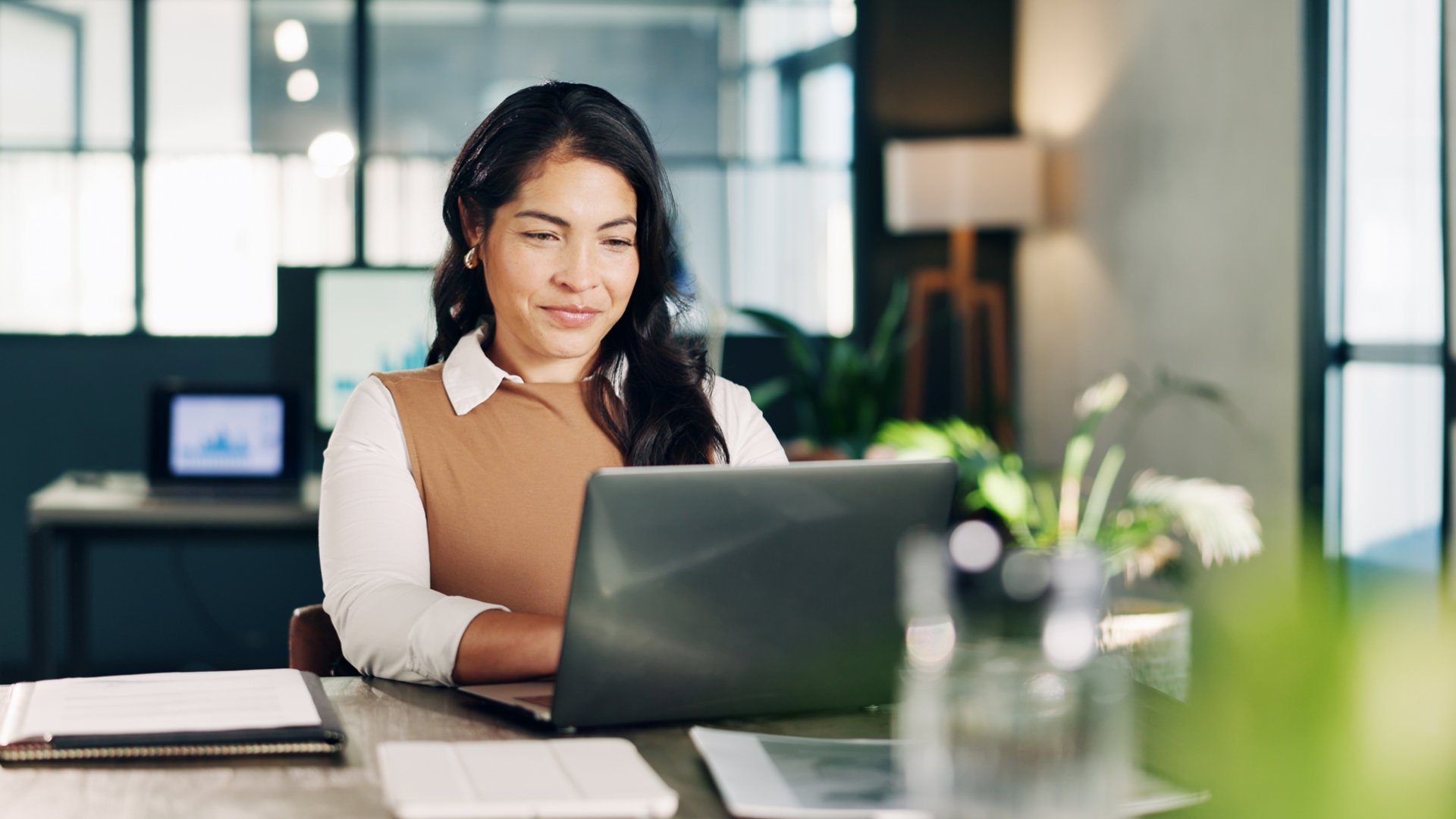 Office, typing and business woman on laptop for financial review, sales analysis and budget planning. Online, manager and person on computer for finance proposal, report and research for strategy.