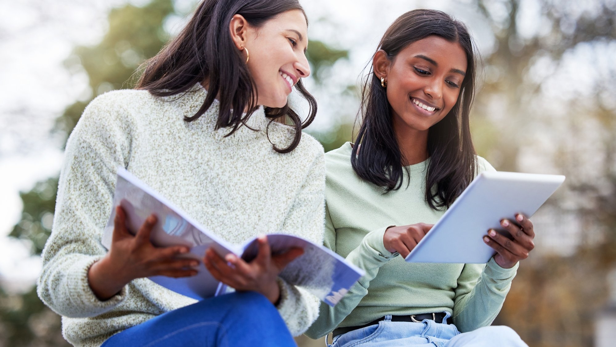 Shot of two young women studying together at college.