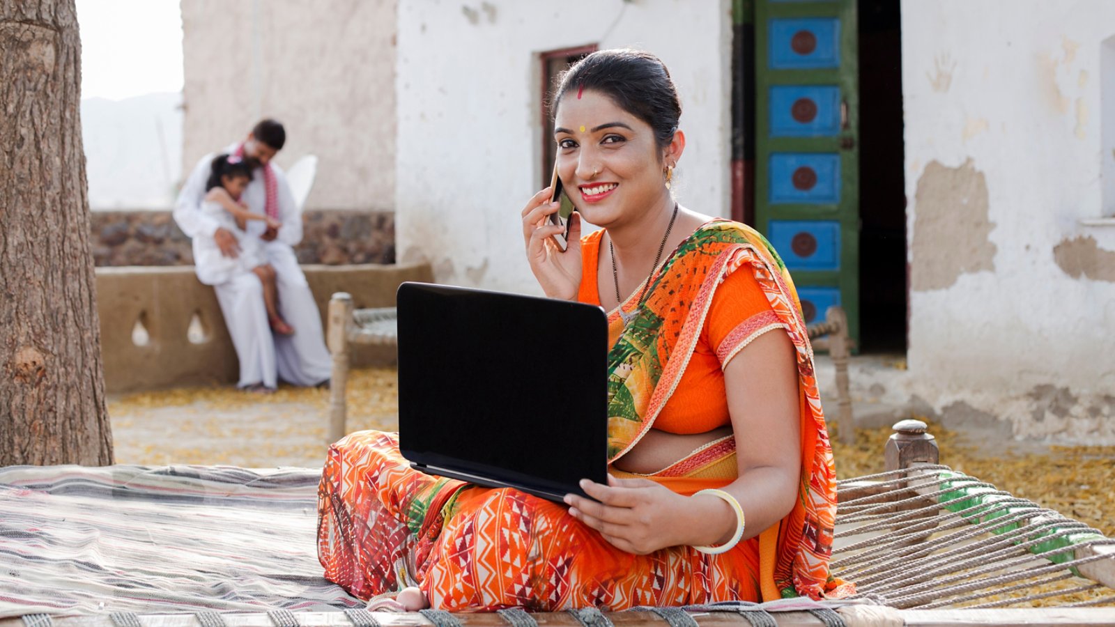 Young rural woman doing online shopping