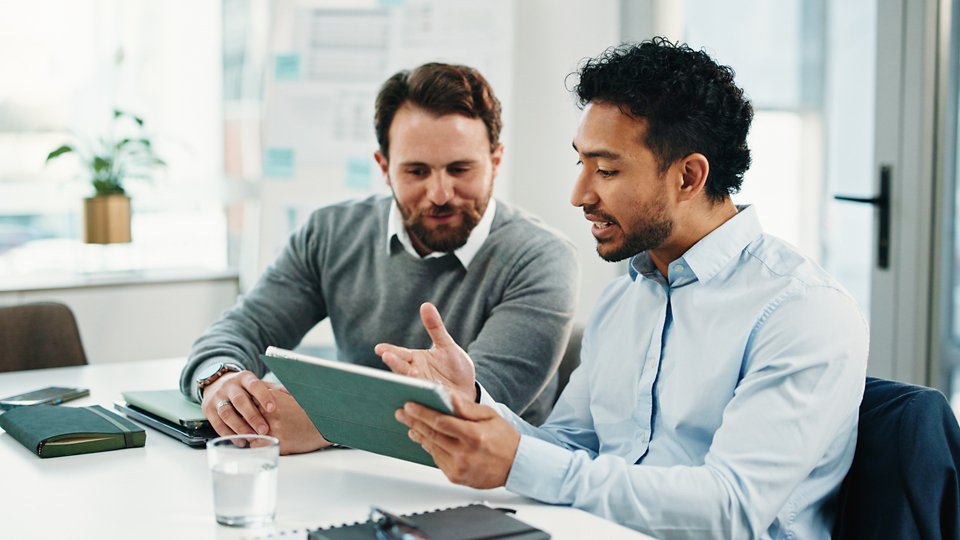 Tablet, team and business men with discussion, insurance proposal or conversation in office. Technology, planning and meeting for idea, risk management and problem solving for policy coverage.