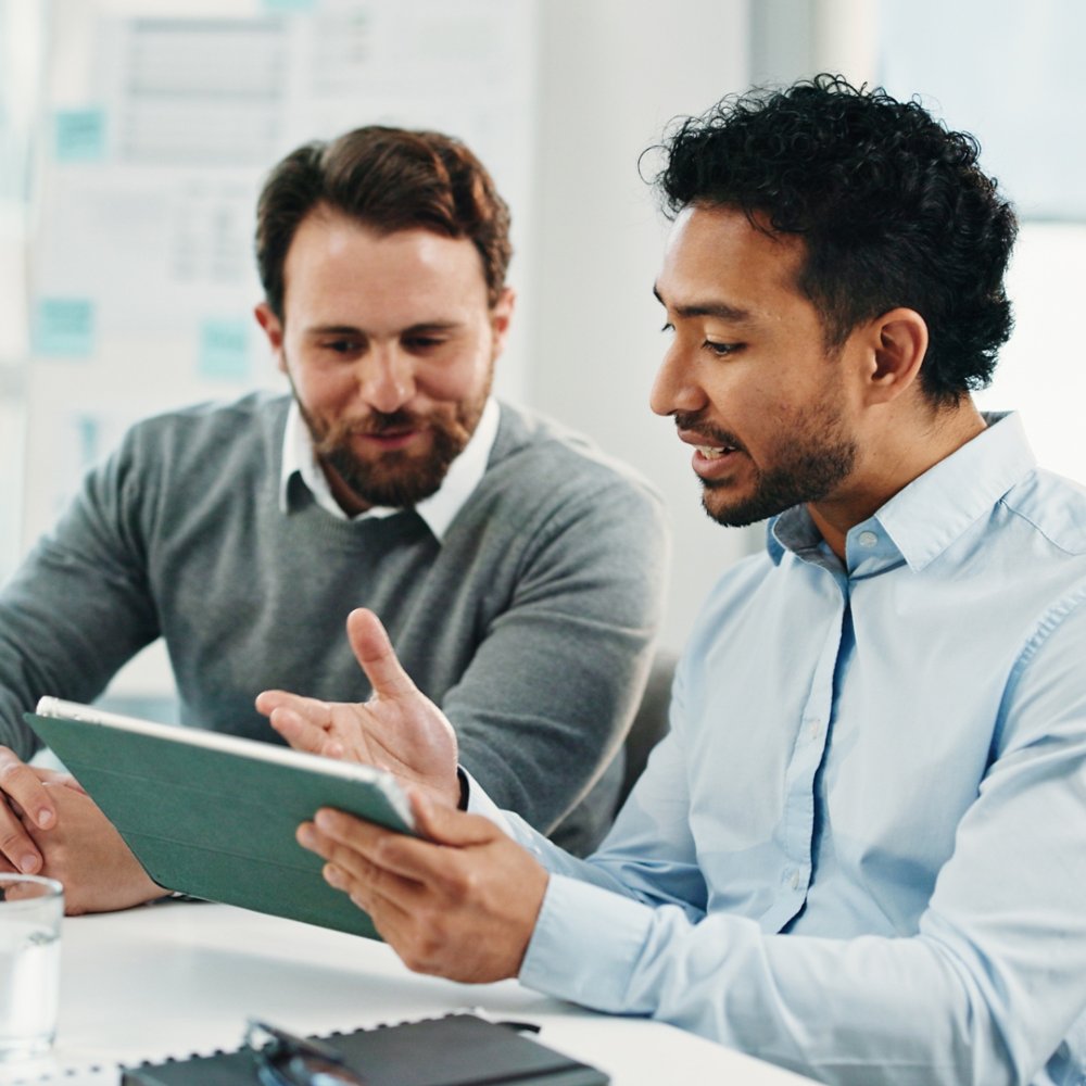 Tablet, team and business men with discussion, insurance proposal or conversation in office. Technology, planning and meeting for idea, risk management and problem solving for policy coverage.