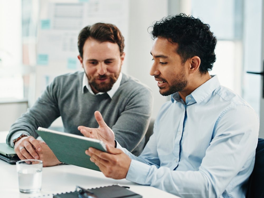 Tablet, team and business men with discussion, insurance proposal or conversation in office. Technology, planning and meeting for idea, risk management and problem solving for policy coverage.