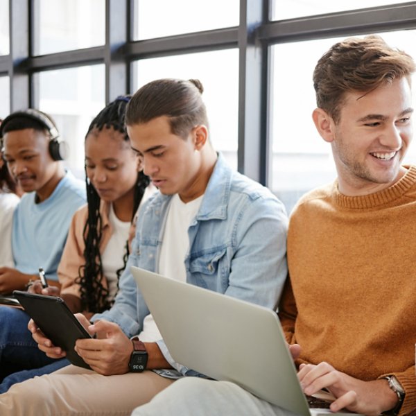 Recruitment, hiring and students in waiting room for internship at startup company, talking and bonding on a floor. Interview, candidate and unemployed youth prepare for meeting with HR at agency.