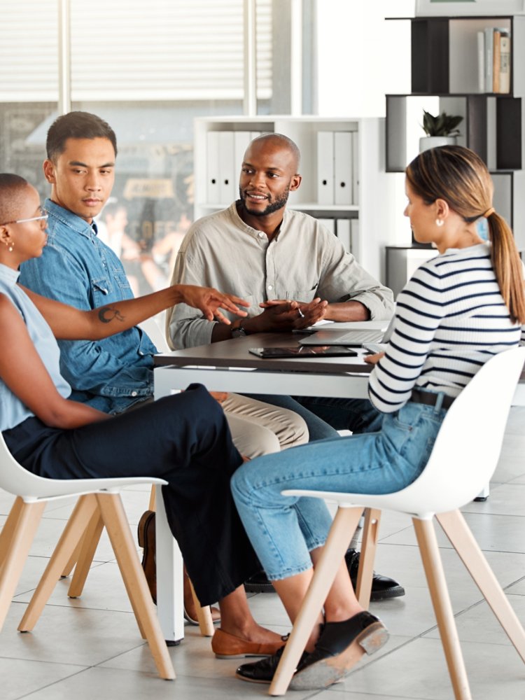 Business people, meeting and diversity in office with digital media management team and chat. Teamwork, conversation and online campaign launch and planning at desk with collaboration at startup.