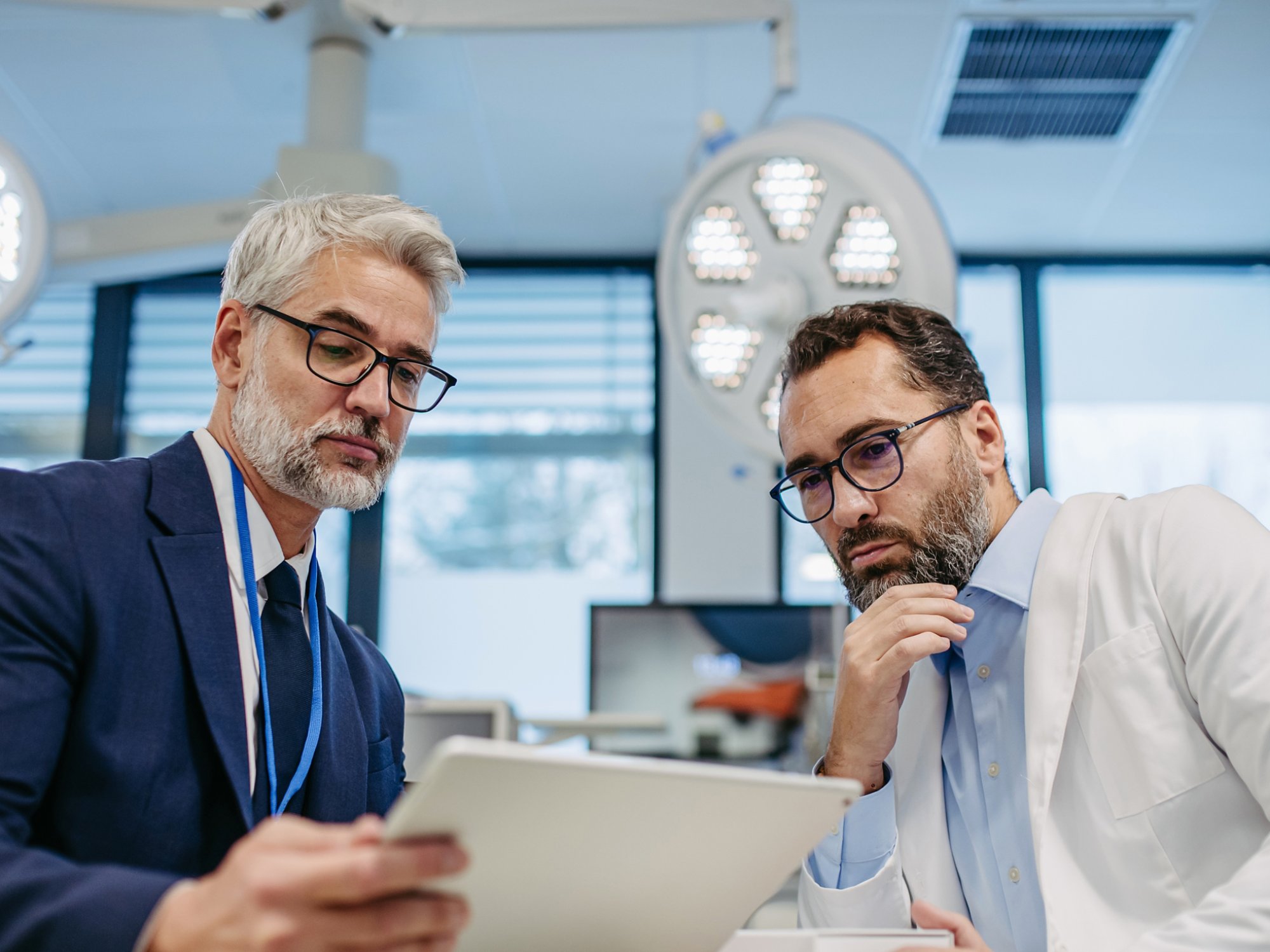 A healthcare professional is collaborating with their IT services counterpart to improve performance and increase margins.