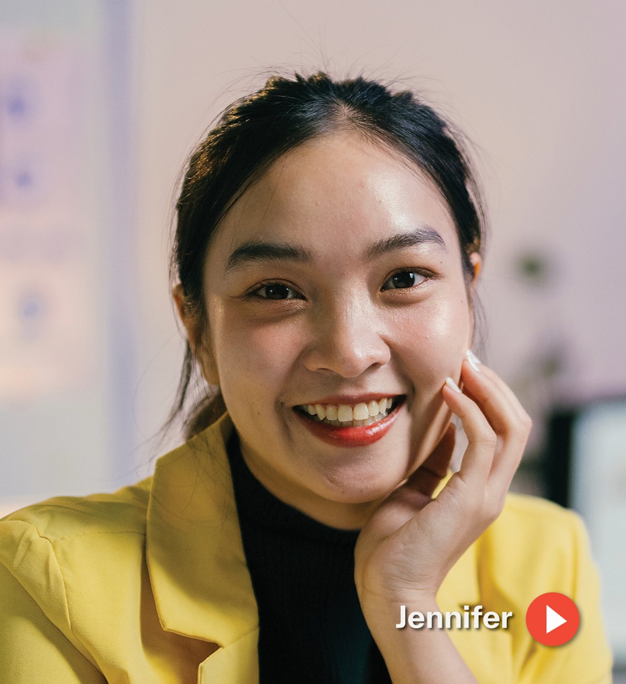 Woman in yellow blazer indoors 