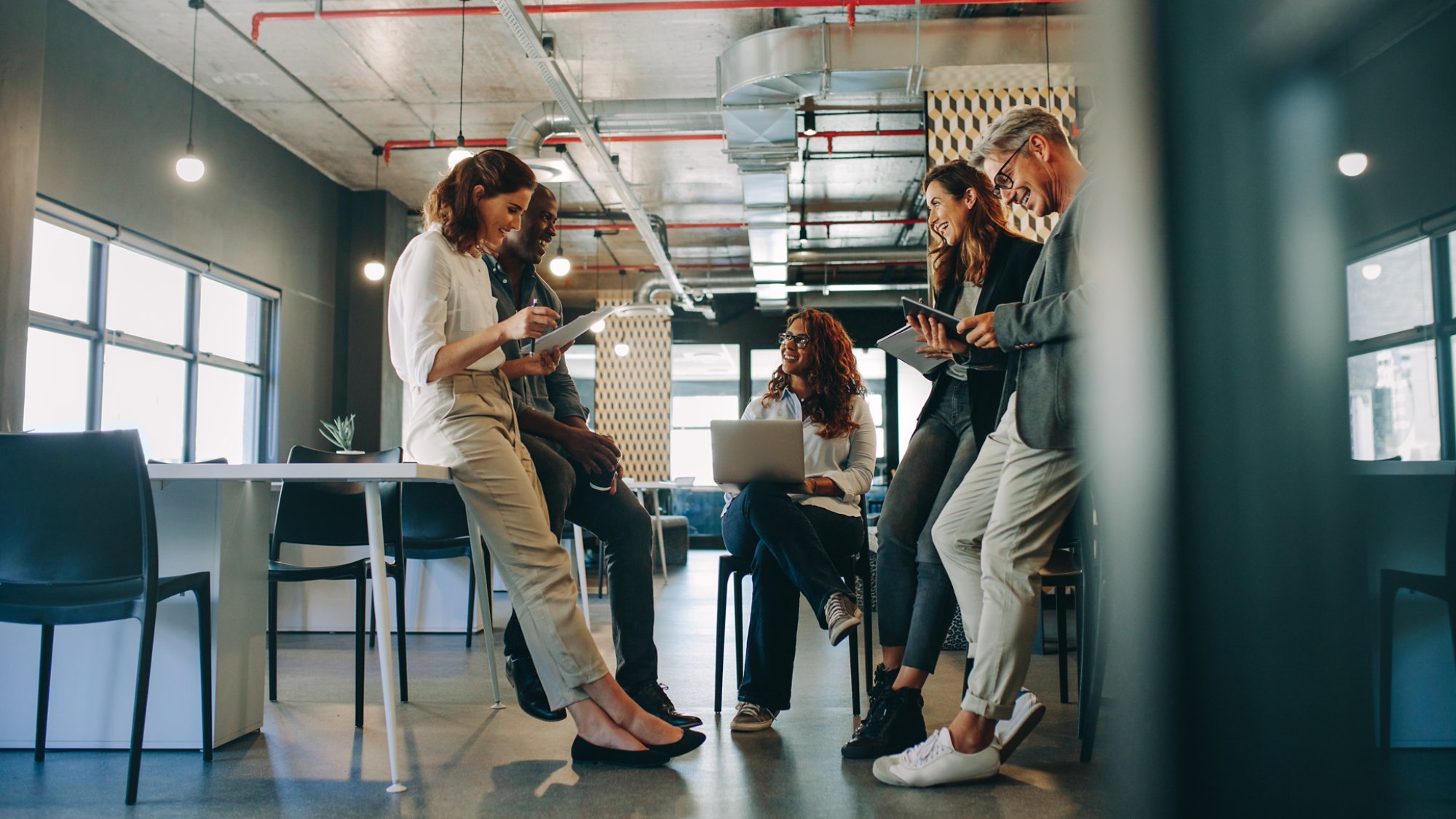 Employees meeting in a modern office. Group of multi-ethnic business people having a meeting at startup office.